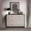 Mackenzie 05 Chest of Drawers / Sideboard | Color: Dunin Oak / High-Gloss Cashmere | Dimensions: 117 x 40 x 85 cm | Handles: Metal | 1 door | 3 drawers | Soft-close