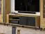 TV base cabinet Lassila 06, Colour: oak Artisan / black - measurements: 54 x 155 x 40 cm (H x W x D), with two doors and four compartments.