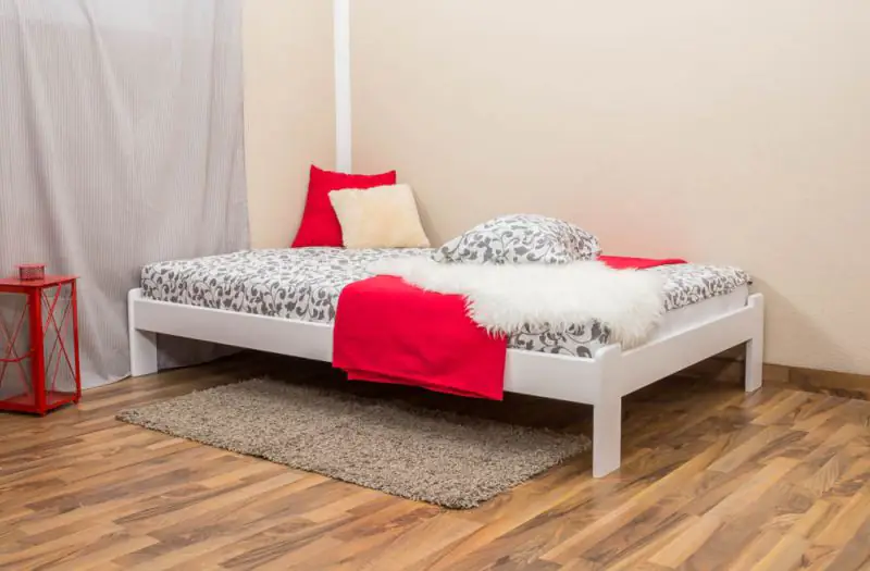 Platform bed / Solid wood bed with low foot end A10, solid pine wood, white finish, incl. slatted frame - 120 x 200 cm 